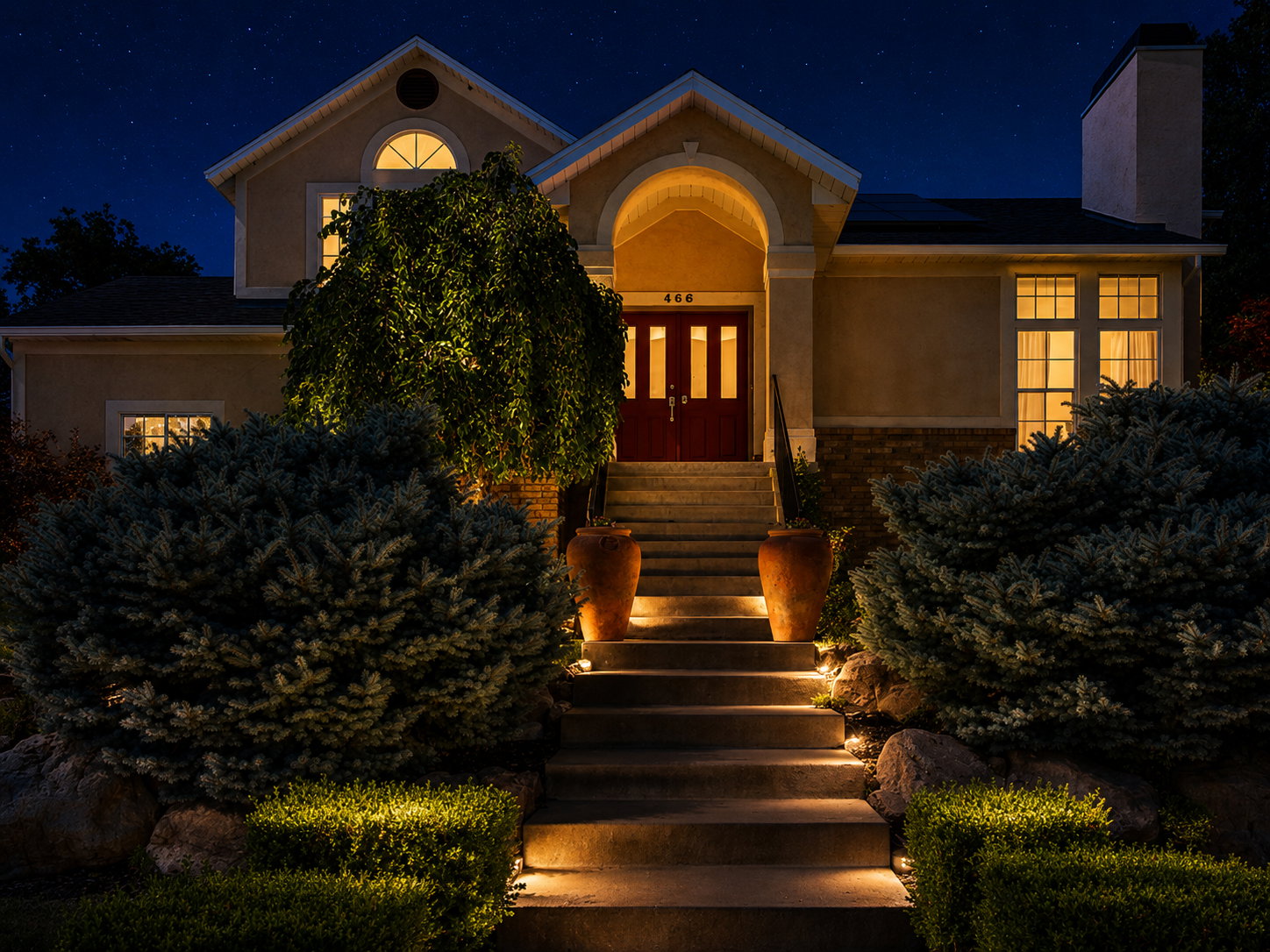 Stucco-finish exterior with a prominent arched entry