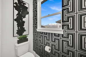 Bathroom featuring toilet and a mountain view