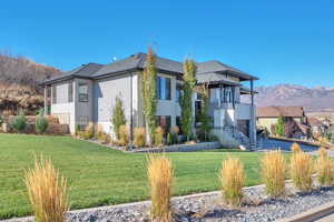 View of building exterior with a mountain view and stairs