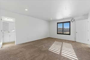 Bedroom featuring light colored carpet and recessed lighting