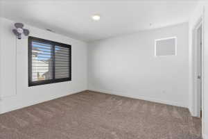Bedroom with carpet floors and baseboards