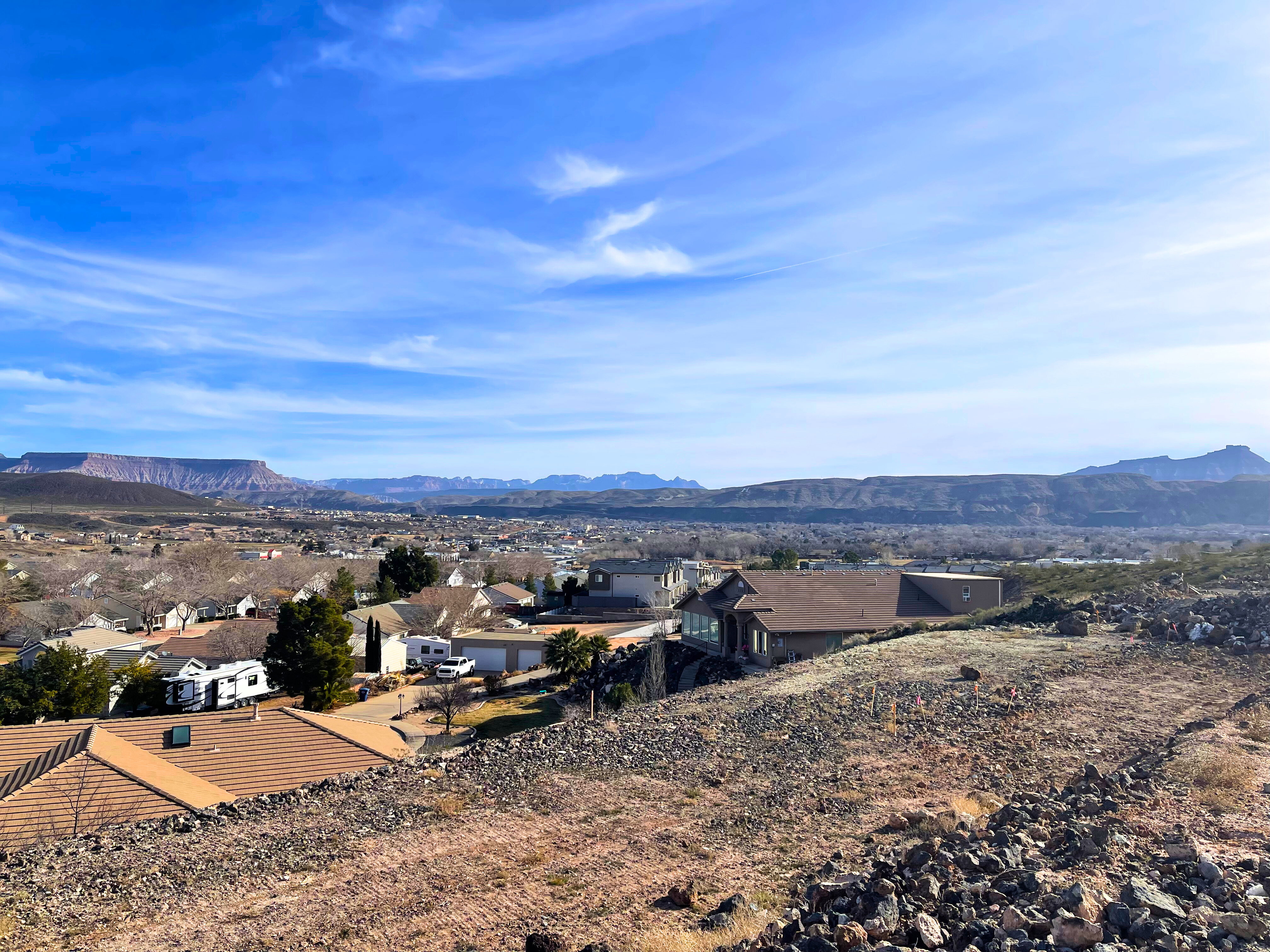 View of mountain backdrop with nearby suburban area
