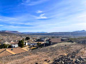 View of mountain backdrop with nearby suburban area