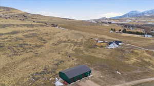 Aerial view of sparsely populated area featuring a mountain backdrop