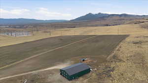 View of yard featuring a rural view and a mountain view