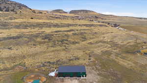 View of mountain backdrop featuring rural landscape