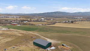 Aerial view of sparsely populated area featuring a mountain backdrop
