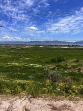 View of mountain backdrop featuring rural landscape