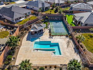 Aerial perspective of suburban area featuring a pool