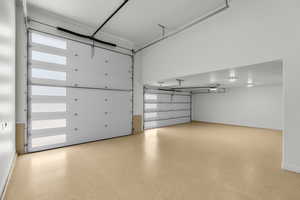 Garage featuring baseboards
