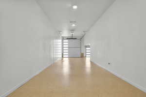 Garage featuring baseboards