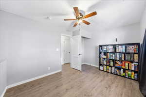 Unfurnished bedroom featuring light wood finished floors and a ceiling fan