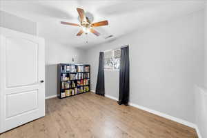Bedroom featuring light wood-style flooring and ceiling fan