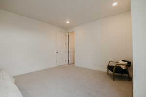 Unfurnished room with carpet floors and recessed lighting