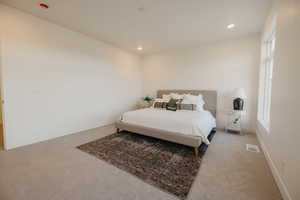 Bedroom featuring recessed lighting and carpet flooring