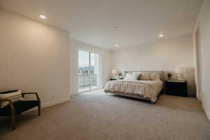 Carpeted bedroom featuring access to outside and recessed lighting