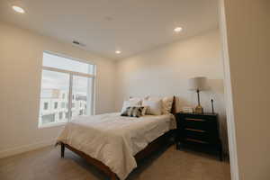 Bedroom with recessed lighting and carpet floors