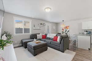 Living room with light wood finished floors and baseboards