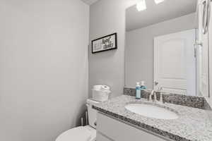 Bathroom with vanity and toilet