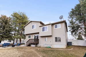 Rear view of property with an outdoor fire pit, a patio, a gate, and stairs