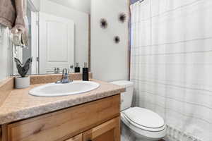 Full bathroom with vanity and shower