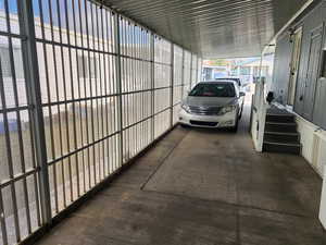 View of car parking with an attached carport