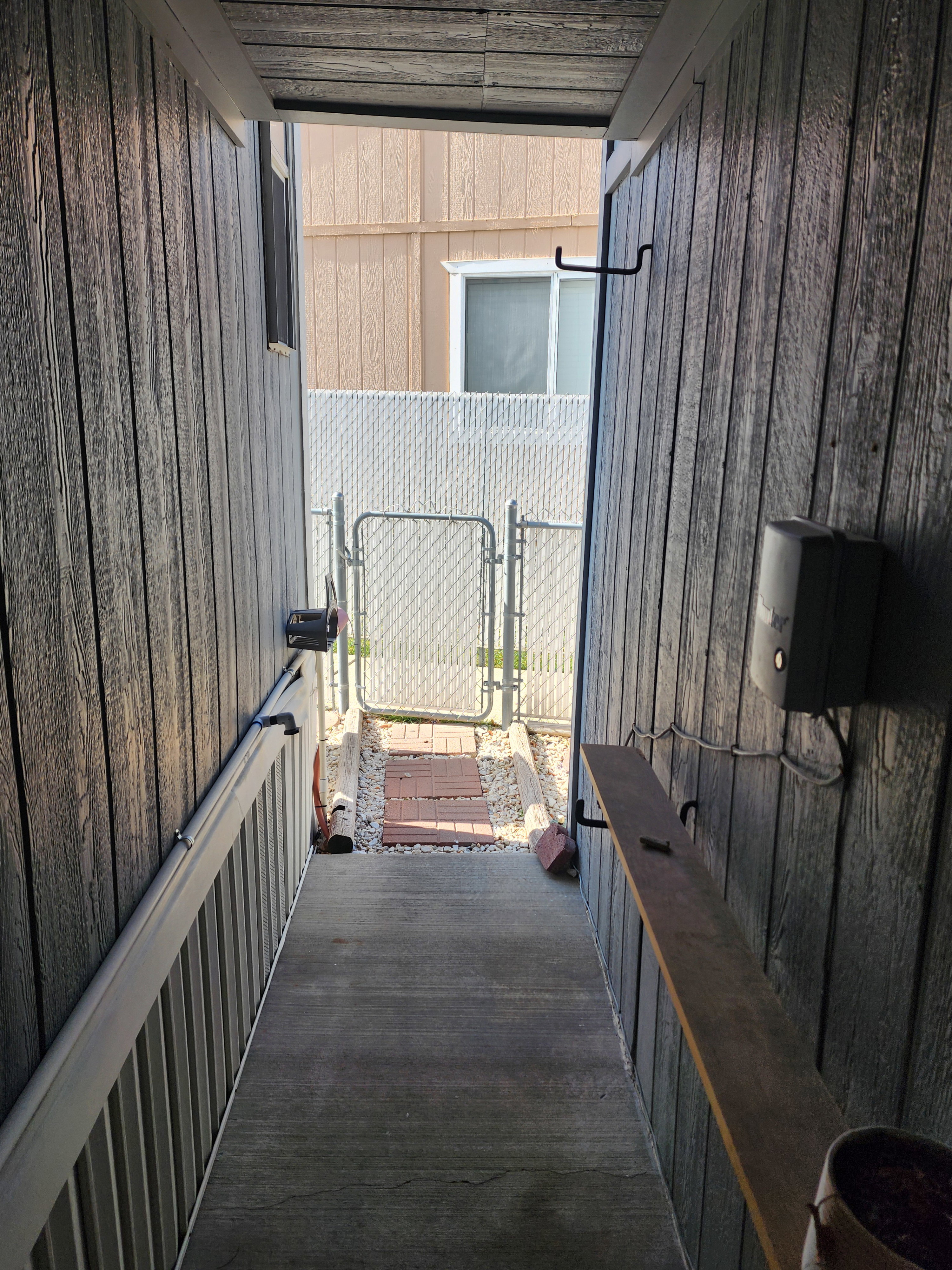 View of patio featuring a gate