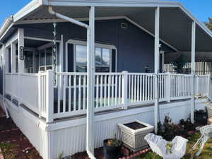 View of side of home featuring a large porch