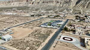 Aerial overview of property's location with nearby suburban area and mountains