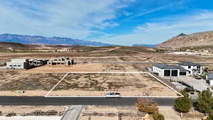 Overview of rural landscape featuring a mountain backdrop and a desert landscape