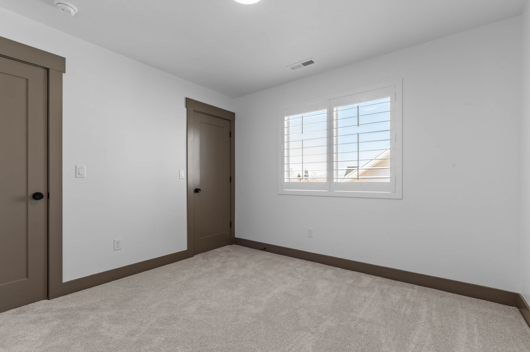 Unfurnished bedroom featuring carpet and a closet
