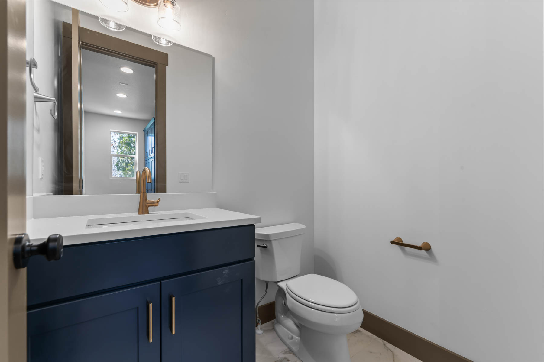 Bathroom featuring vanity and recessed lighting