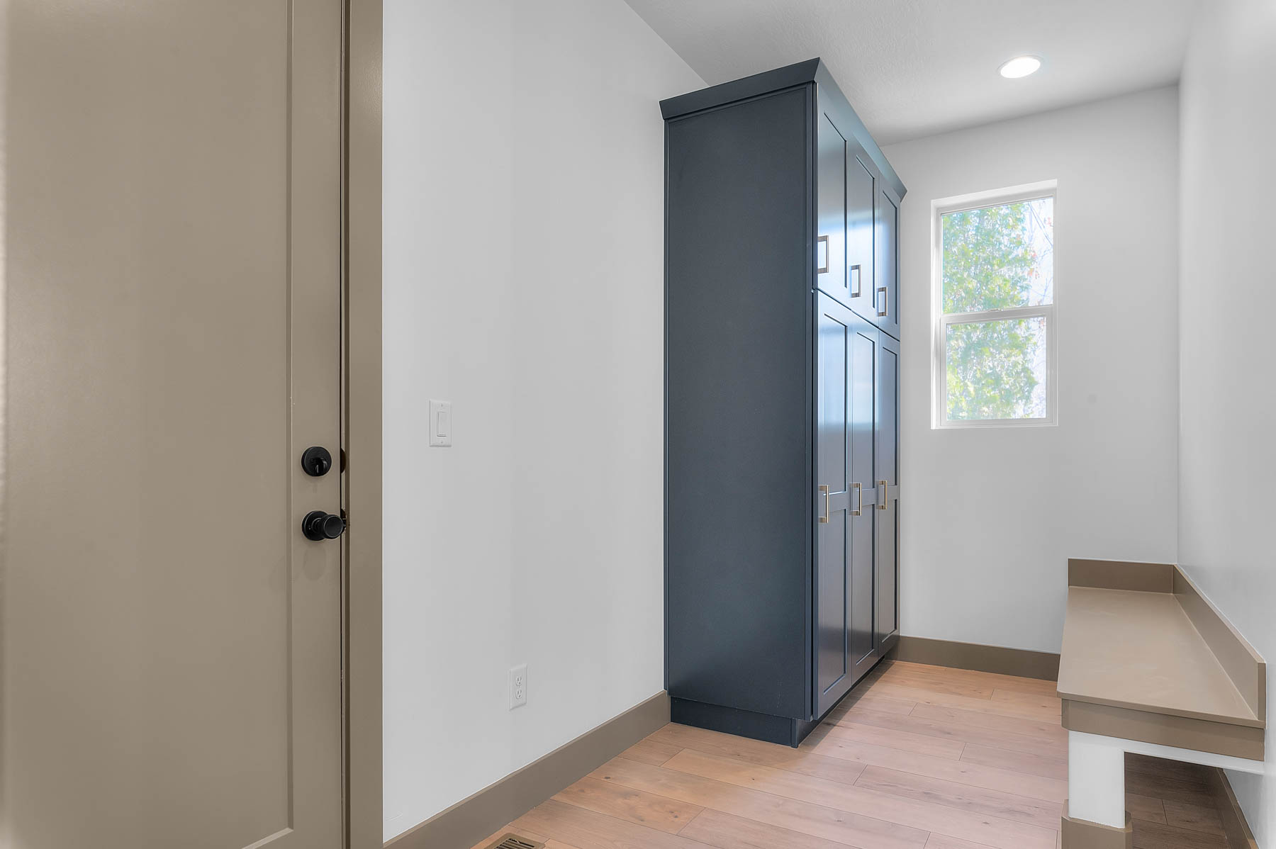 Interior space with wood finished floors and recessed lighting
