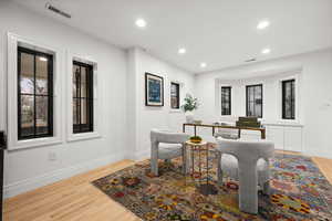 Living area featuring recessed lighting, light wood-style flooring, and an office area