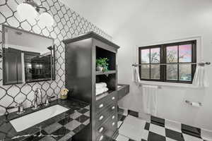 Bathroom with vanity and tile patterned floors