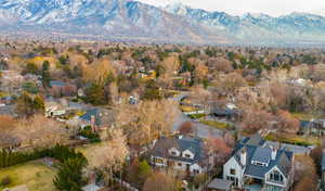 Aerial view of residential area featuring a mountain backdrop