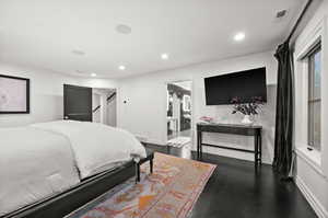Master Bedroom with recessed lighting and dark wood-style floors