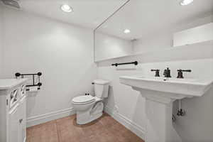 Bathroom with toilet and recessed lighting