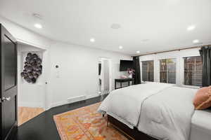 Master Bedroom with recessed lighting and wood finished floors