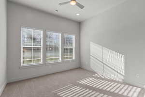Unfurnished room with light colored carpet, a ceiling fan, and recessed lighting