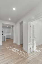 Unfurnished living room with recessed lighting and light wood finished floors