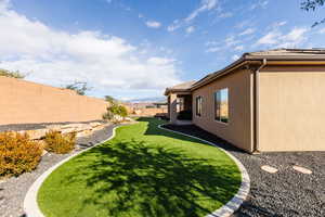 Fenced backyard with a patio