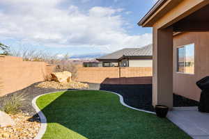Fenced backyard featuring a patio area