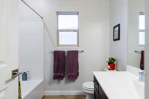Full bath featuring vanity and shower / washtub combination
