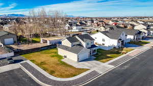 Aerial perspective of suburban area with a mountainous background