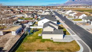 Aerial perspective of suburban area with a mountain backdrop