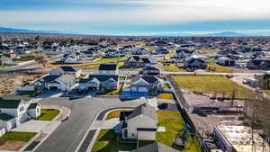 Aerial view of residential area featuring a mountain backdrop