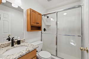 Full bath featuring vanity and a stall shower