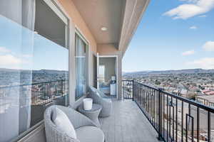 Balcony featuring a mountain view and a residential view
