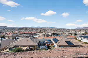 Aerial view of residential area featuring a mountainous background